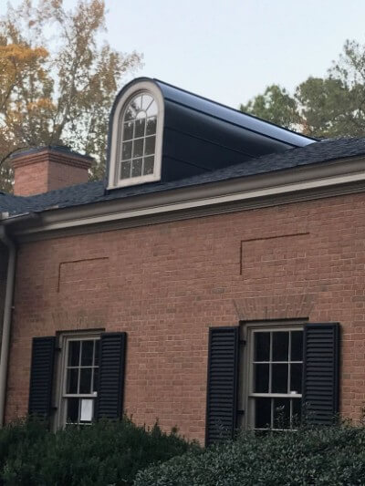 Snaplock onyx metal roof with a segmental dormer
