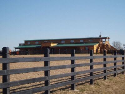 Forest green rib roofing over a barn