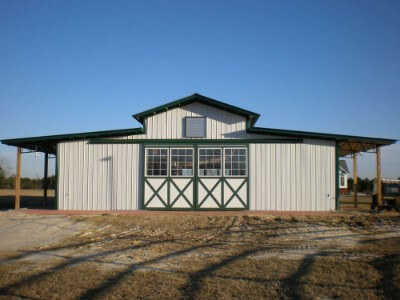 Agriculture structure with forest green roofing and metal walls