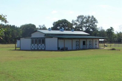 Animal stable with metal roofing and walls