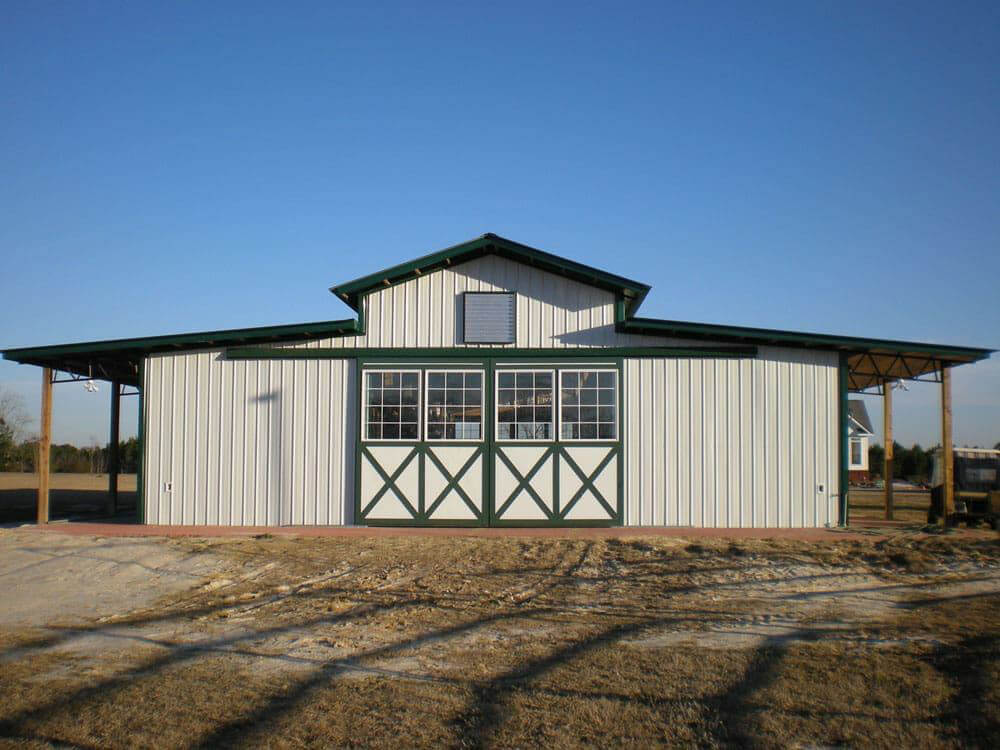 Large-scale agricultural pole barn structure with metal siding